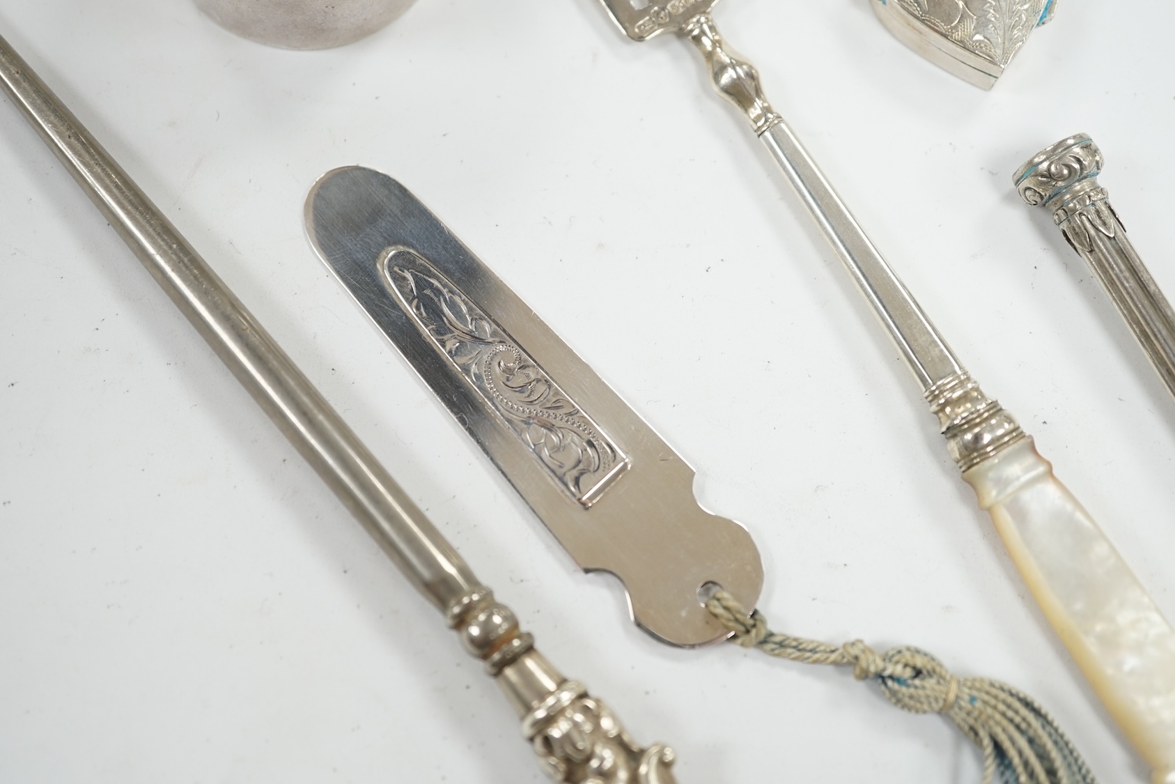 Small silver including a late Victorian slide action pill box, Birmingham, 1890, a heart shaped pill box, a book mark, pencil, pickle fork and a button hook